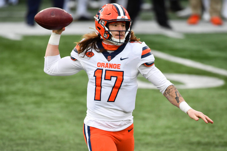Rex Culpepper on the football field preparing to throw a football