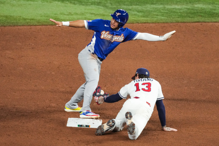Brice Turang is late with the tag as Venezuela Javier Sanoja steals second base