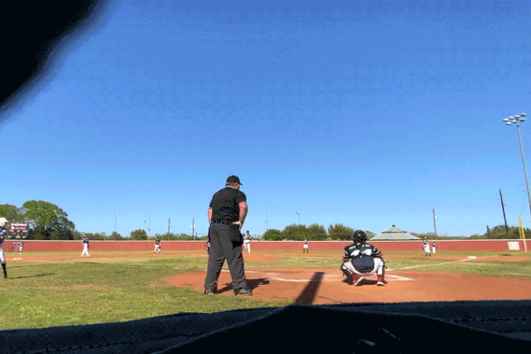 A meteor flies through the sky during a baseball game