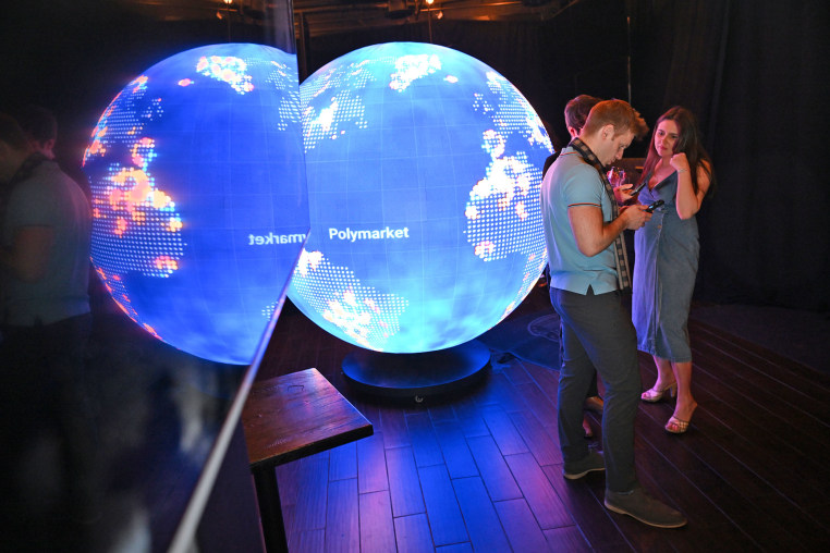 People gather during the opening of the Polymarket bar “The Situation Room” on March 20, 2026 in Washington, D.C.
