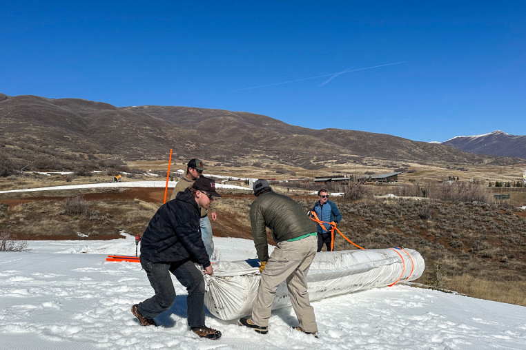 Soldier Hollow Nordic Center staa roll out Snow Secure as part of the snow preservation process.