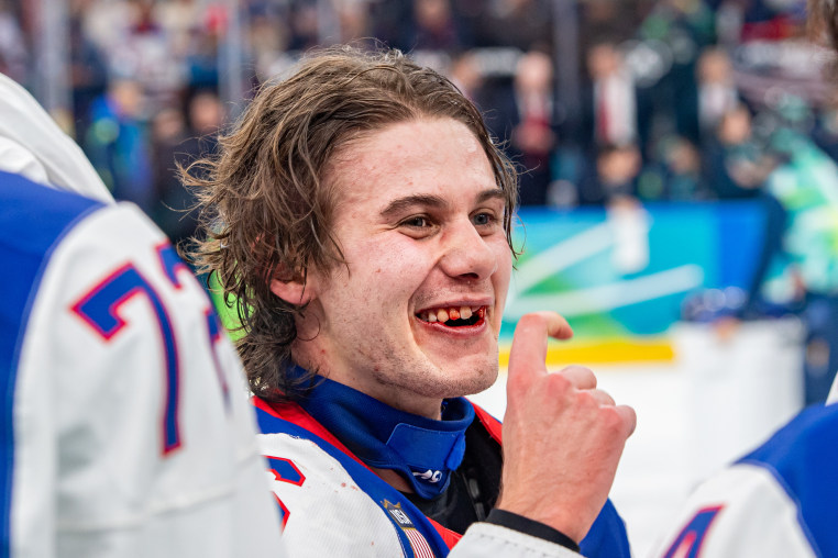 MILAN, ITALY - FEBRUARY 22: U.S. hockey star Jack Hughes celebrates after the men's gold medal game between Canada and United States.