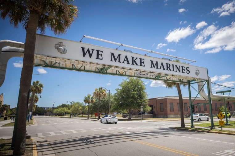 A car drives under a sign that states the sole purpose of the Marine Corps Recruiting Depot, Wednesday, May 11, 2022, in Parris Island, SC. The recruiting depot at Parris Island is one of only two in the United States, the other is the Marine Corps Recruiting Depot San Diego.