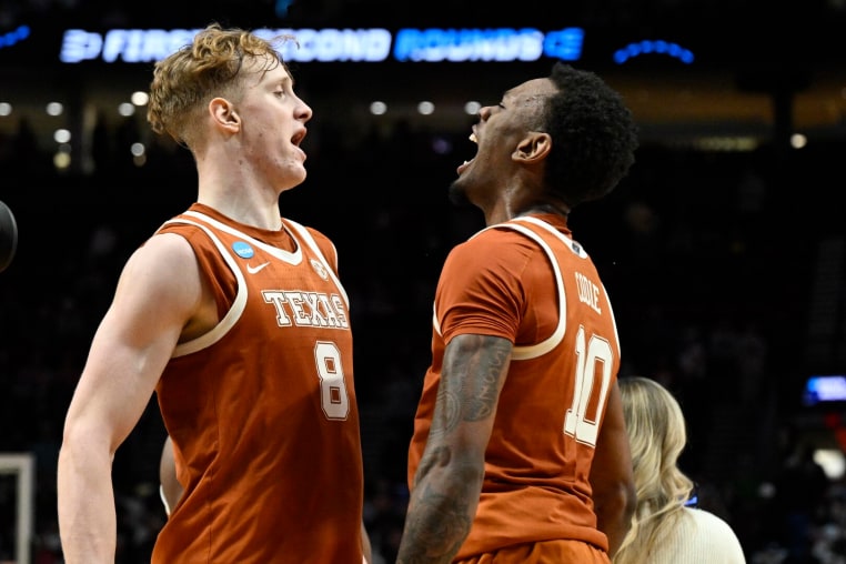 Mar 21, 2026; Portland, OR, USA; Texas Longhorns center Matas Vokietaitis (8) and forward Nic Codie (10) react after defeating the Gonzaga Bulldogs during a second round game of the men's 2026 NCAA Tournament at Moda Center. Mandatory Credit: Troy Wayrynen-Imagn Images