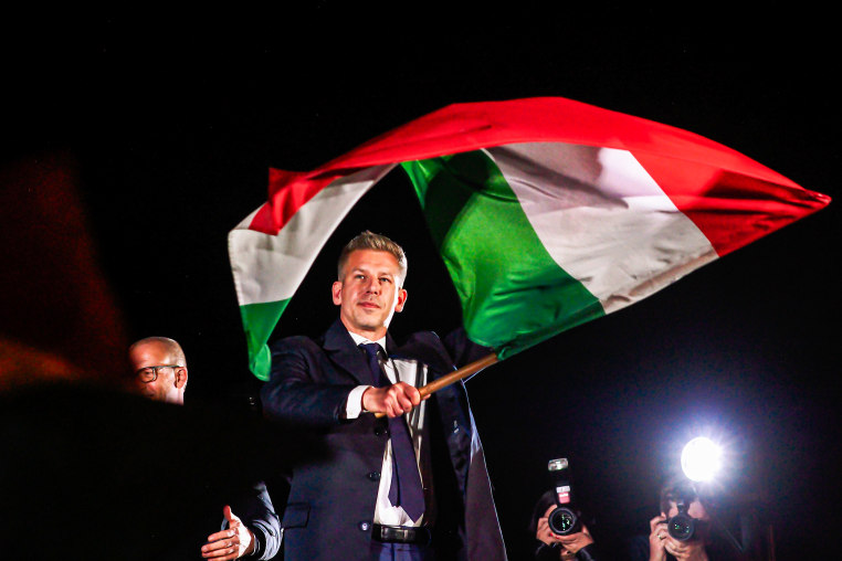 New Prime Minister of Hungary Peter Magyar waves a Hungarian