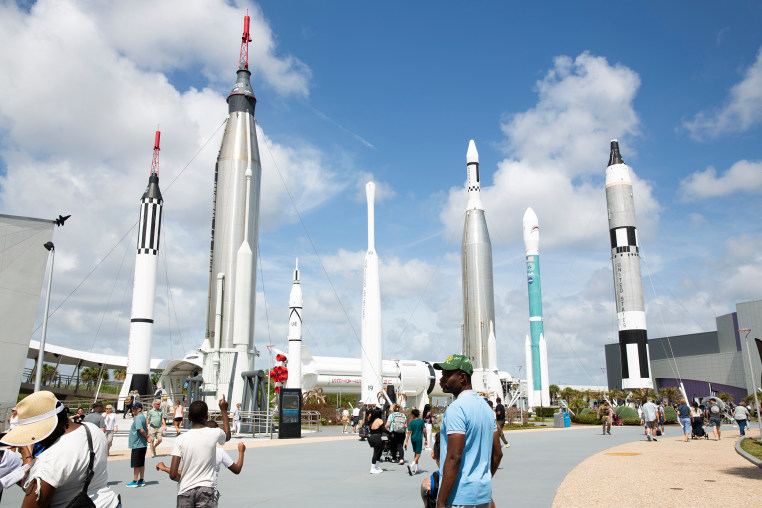 People gather at Kennedy Space Center Visitor Complex in Merritt Island, Fla., on Tuesday.