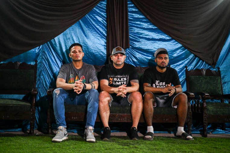 Mervin Yamarte, Ringo Rincon and Edwuar Hernandez, and Andy Perozo (not pictured), Venezuelan migrants repatriated from a prison in El Salvador, attend a Christian evangelicals service in Venezuela, on July 23, 2025.