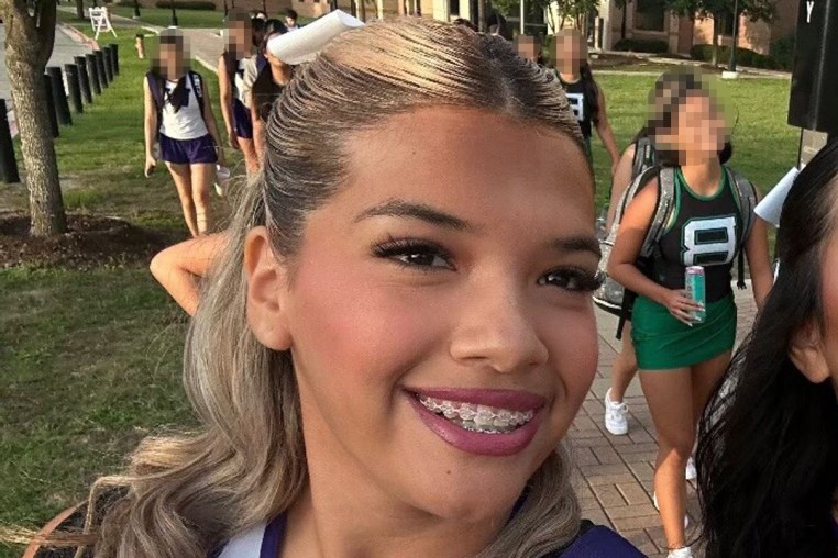 Larissa Nicole Rodriguez holds a can of Alani Nu, an energy drink with 200 mg of caffeine.