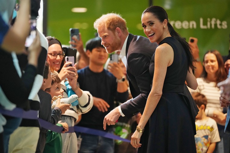 Prince Harry and Meghan, Duchess of Sussex, meet children and their families during a visit to a hospital in Australia. 