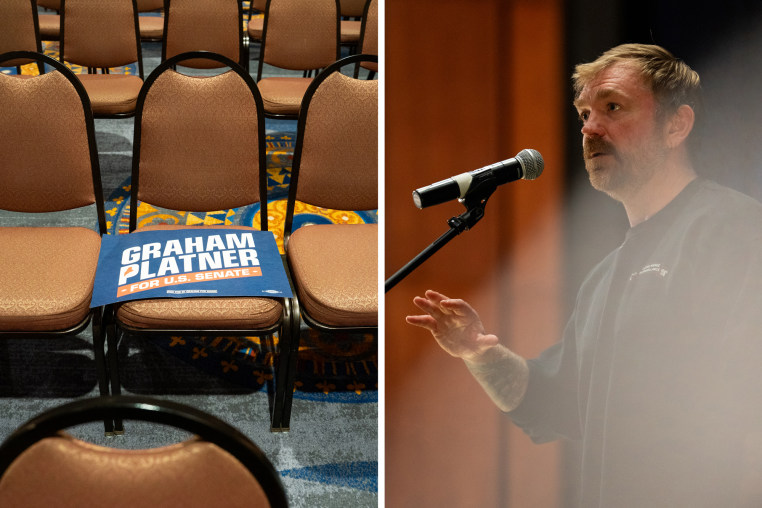 Graham Platner talks into a standing microphone on stage