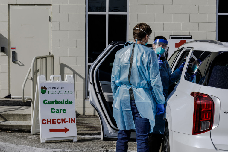 Parkside Pediatrics providers assessing a patient with measles symptoms.