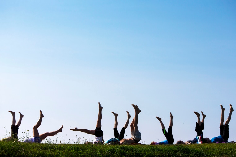 Yoga students point their toes skyward during a weekly session at Kettle Cove. The donation-based classes are held on Fridays at 8 a.m. The donations are split between Kettle Cove State Park and South Portland-based nonprofit group Cultivating Balance, teacher Melora Gregory said.