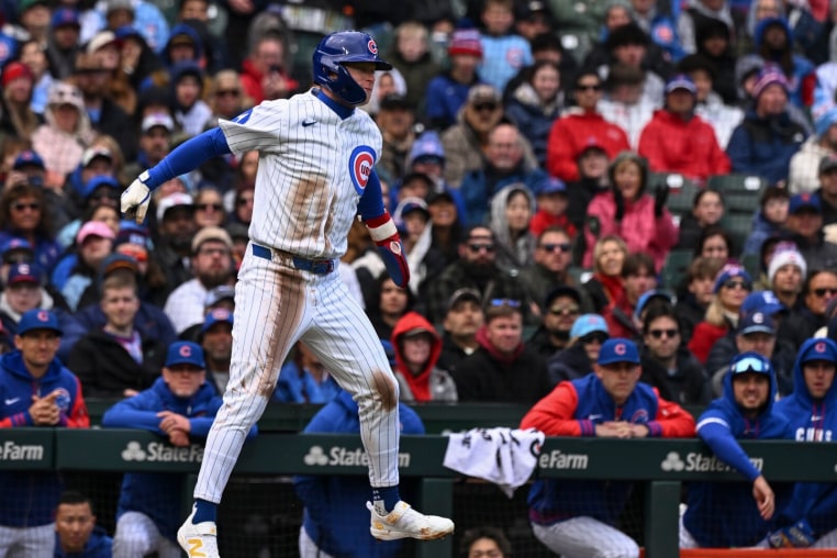 Apr 19, 2026; Chicago, Illinois, USA; Chicago Cubs center fielder Pete Crow-Armstrong (4) jumps while waiting to head home after hitting a triple during the third inning at Wrigley Field. Mandatory Credit: Matt Marton-Imagn Images