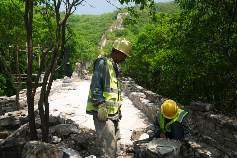 Construction workers at Phase 5 of the Great Wall reconstruction in Jiankou, China on Tuesday.