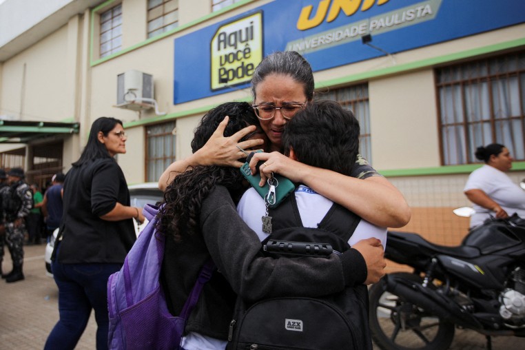 Shooting in school in Brazil kills two staff members dead, local authorities say
