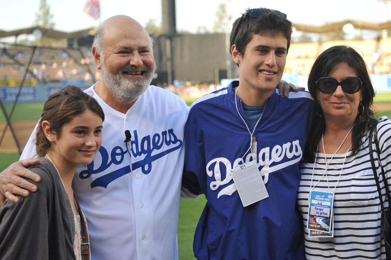June 04, 2010 - Los Angeles, California, U.S - 04 June 2010: The Reiner family from left daughter Romy Reiner, Rob Reiner, Jake Reiner, and Michele Singer Reiner pose for a picture before the Dodgers game. The Los Angeles Dodgers defeated the Atlanta Bra