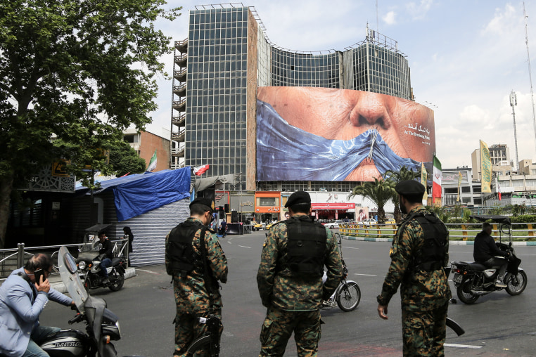 Soldiers standing in a central intersection in Tehran.