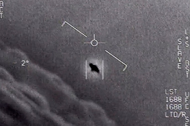The image from video provided by the Department of Defense labelled Gimbal, from 2015, an unexplained object is seen at center as it is tracked as it soars high along the clouds, traveling against the wind.