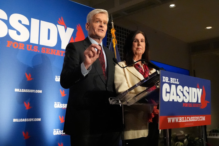 Image: Sen. Bill Cassidy, R-La., left, speaks to supporters alongside his wife, Laura, during an election night watch party.