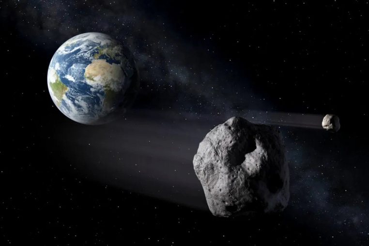 An illustration depicting asteroids passing by planet Earth.