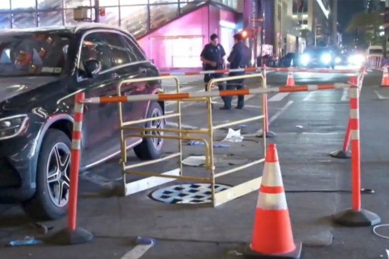 Manhole cover at a crime scene.