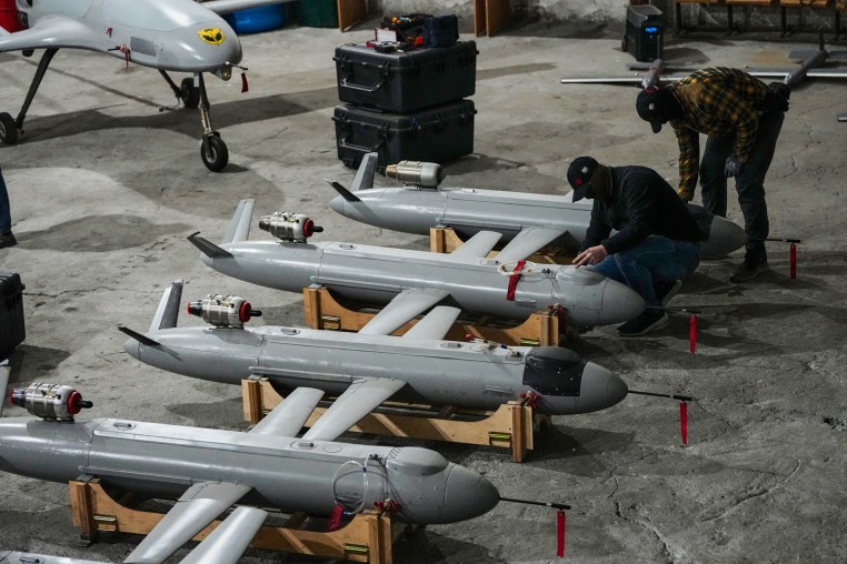 Servicemen of Ukraine's defense intelligence set up the Peklo missile drones inside of a room