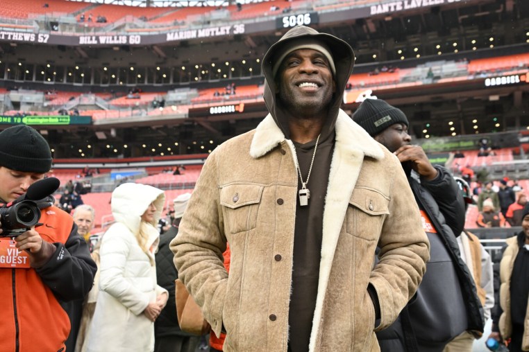 CLEVELAND, OHIO - DECEMBER 07: NFL Deion Sanders waits to greet his son Shedeur Sanders #12 of the Cleveland Browns prior to a game against the Tennessee Titans at Huntington Bank Field on December 07, 2025 in Cleveland, Ohio. (Photo by Jason Miller/Getty Images)