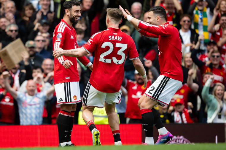 MANCHESTER, ENGLAND - MAY 17: Bruno Fernandes, Luke Shaw and Diogo Dalot of Manchester United celebrate after Bryan Mbeumo of Manchester United (not pictured) scores his teams third goal during the Premier League match between Manchester United and Nottingham Forest at Old Trafford on May 17, 2026 in Manchester, England. (Photo by Ash Donelon/Manchester United via Getty Images)