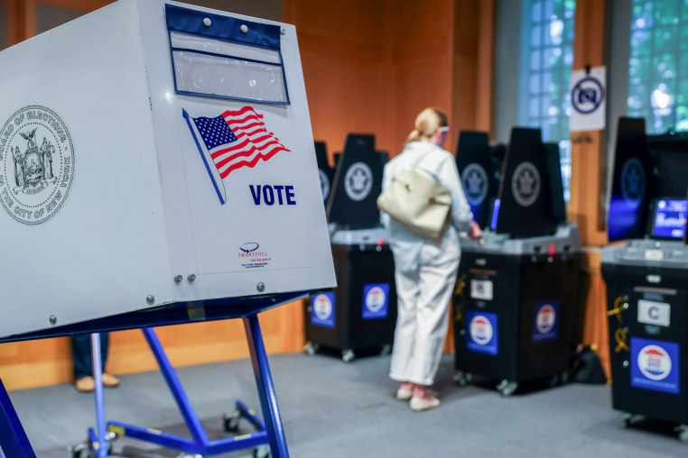 A voting booth as a voter scans their ballot in New York.