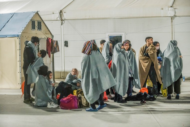 Migrants seen sheltering in the first aid camp