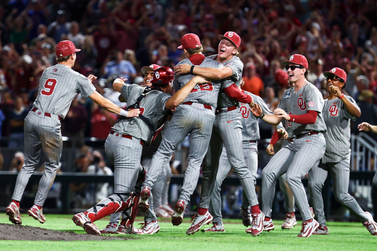 Oklahoma Sooners jump on each other in celebration