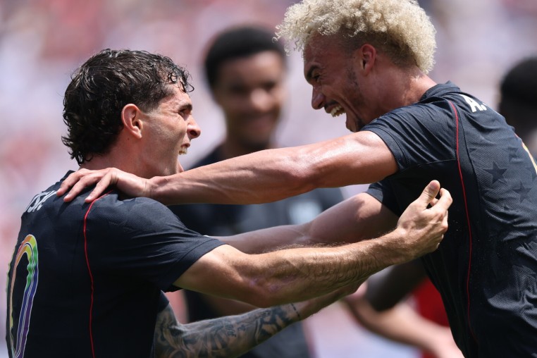 CHICAGO, ILLINOIS - JUNE 06: Antonee Robinson of United States celebrates with teammate Christian Pulisic after scoring his team's first goal during the international friendly match between United States and Germany at Soldier Field on June 06, 2026 in Chicago, Illinois. (Photo by Jamie Squire/Getty Images)