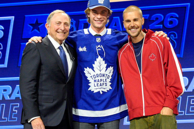 BUFFALO, NEW YORK - JUNE 26: (L-R) NHL Commissioner Gary Bettman, Gavin McKenna and Justin Bieber pose onstage after McKenna was selected first overall by the Toronto Maple Leafs during Day One of the 2026 NHL Draft at KeyBank Center on June 26, 2026 in Buffalo, New York. (Photo by Jeff Vinnick/NHLI via Getty Images)