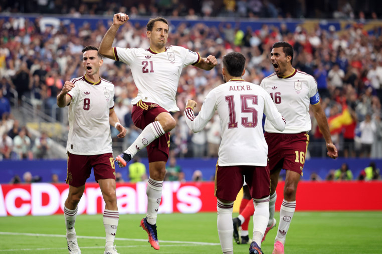 Mikel Oyarzabal of Spain celebrates with teammates after converting a penalty to score the team's first goal during the World Cup 2026 semifinal match against France on July 14, 2026.