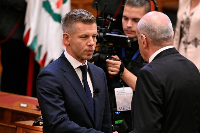 Hungary's new Prime Minister Peter Magyar shakes hands with Hungarian President Tamas Sulyok during the swearing-in ceremony at the Hungarian parliament in Budapest on May 9.