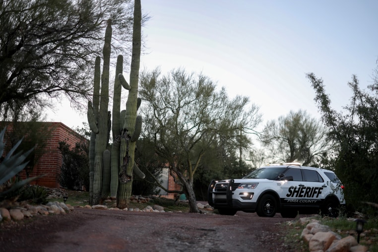 A Pima County Sheriff's vehicle parks in the driveway of the home of Nancy Guthrie in Tucson.