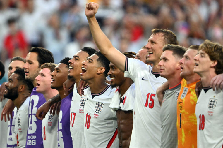 England's midfielder #10 Jude Bellingham (C) and teammates celebrate after winning the 2026 World Cup football tournament quarter-final match between Norway and England at Miami Stadium in Miami Gardens on July 11, 2026. (Photo by MAURO PIMENTEL / AFP via Getty Images)