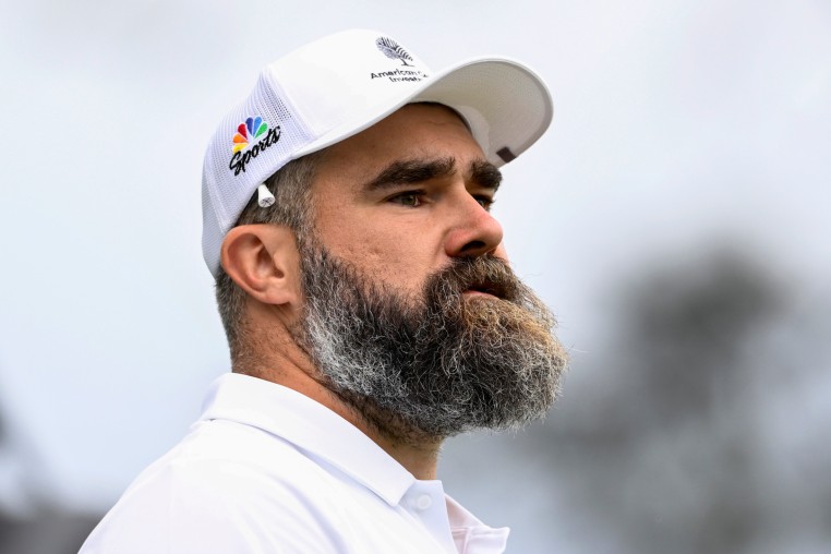 Jason Kelce stands looking away.