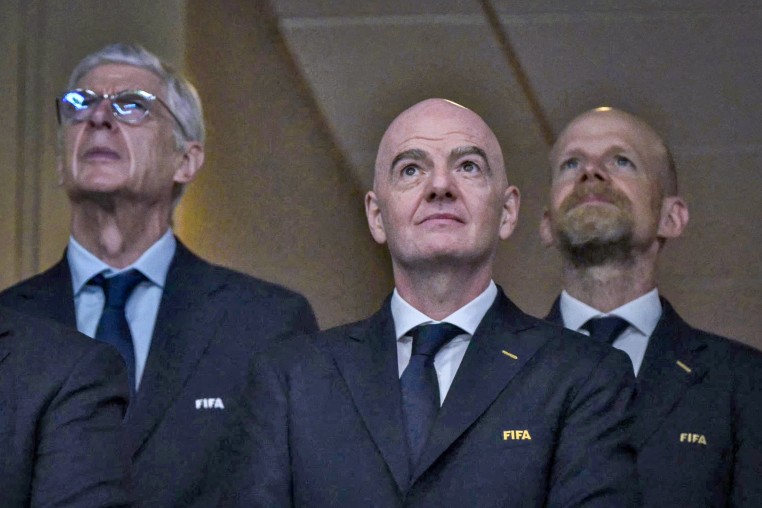 Gianni Infantino, Arsène Wenger and Mattias Grafström.