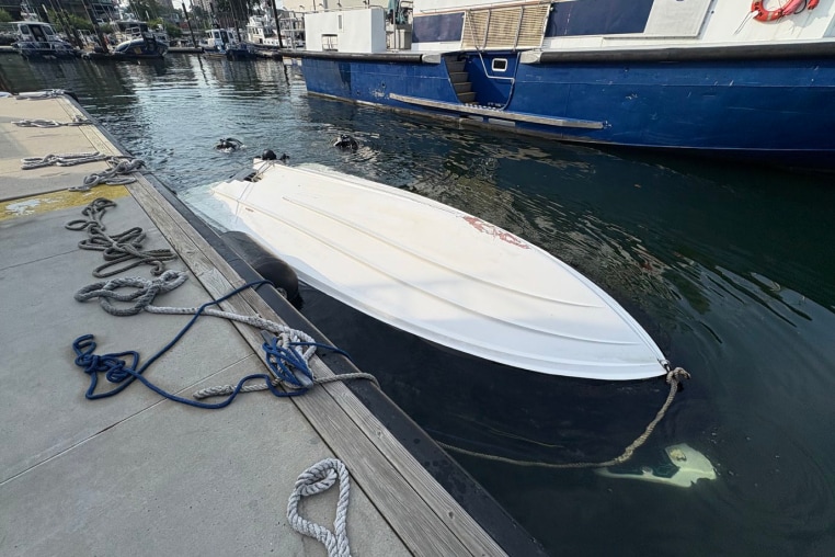 The capsized Vessel, tied to a pier after the capsizing, on Aug. 8, 2026.