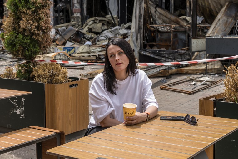 Image: Zlatoslava Supruniuk poses for a portrait outside McDonald's