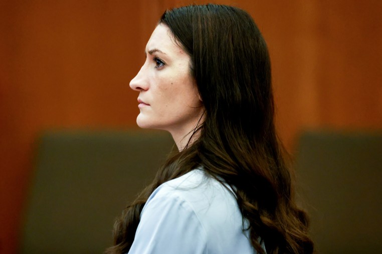 Side profile of Lindsay Clancy sitting inside of a court room
