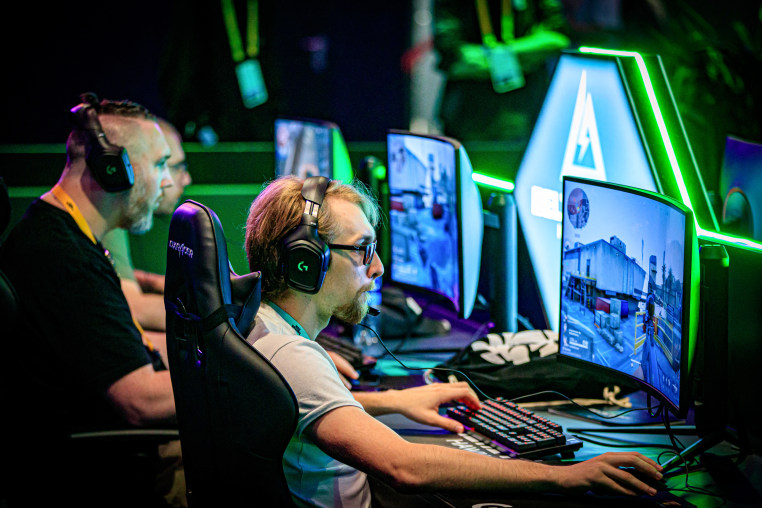 Visitors play video-games on computers.