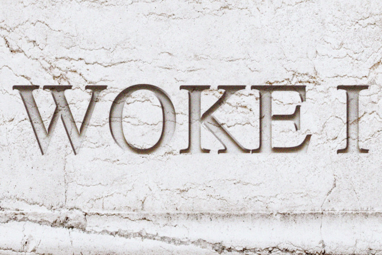 An illustration of "Woke I" carved into marble.