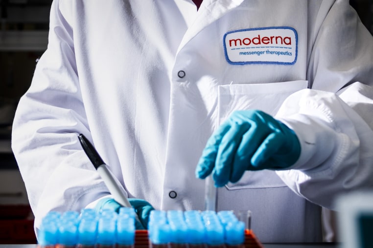A researcher works in the lab at the Moderna headquarters in Cambridge, Mass. 