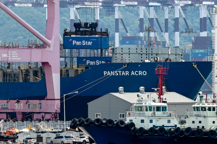 A container is loaded to the container ship "Panstar Acro."