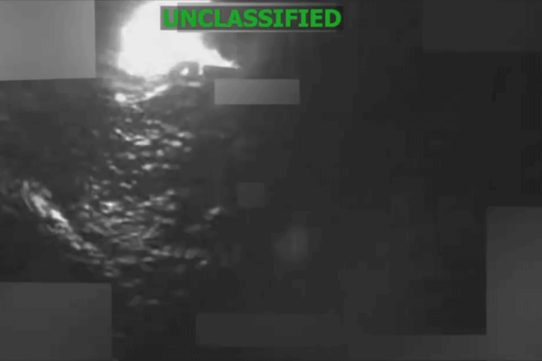 An animated video depicting a vessel in the water before and after an airstrike.