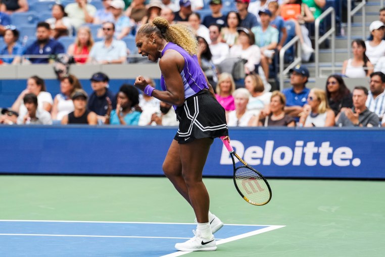Serena Williams reacting during a tennis match.