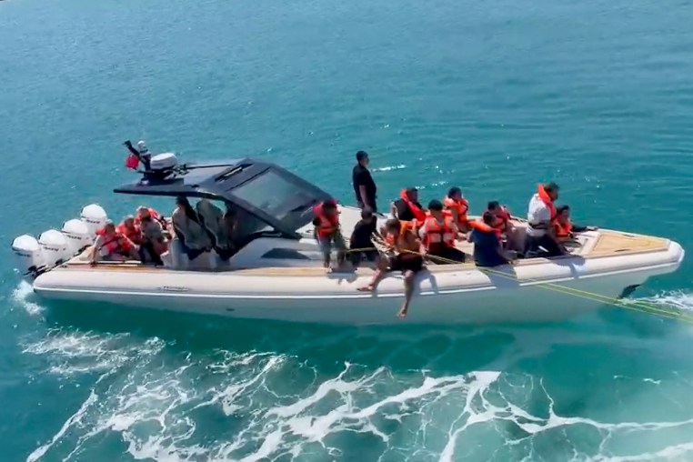 A frame grab from video of rescued passengers wearing life jackets,