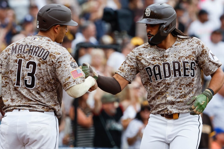 SAN DIEGO, CALIFORNIA - AUGUST 9: Manny Machado #13 and Fernando Tatis Jr. #23 of the San Diego Padres celebrate after Tatis' three-run home run against the Houston Astros during the fourth inning at Petco Park on August 9, 2026 in San Diego, California. (Photo by Meg McLaughlin/Getty Images)